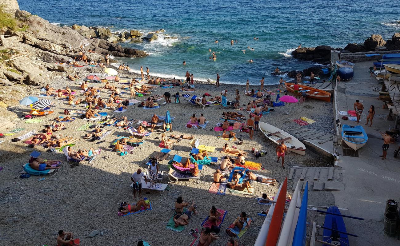 Фото Spiaggia Murcarolo с серая галька поверхностью