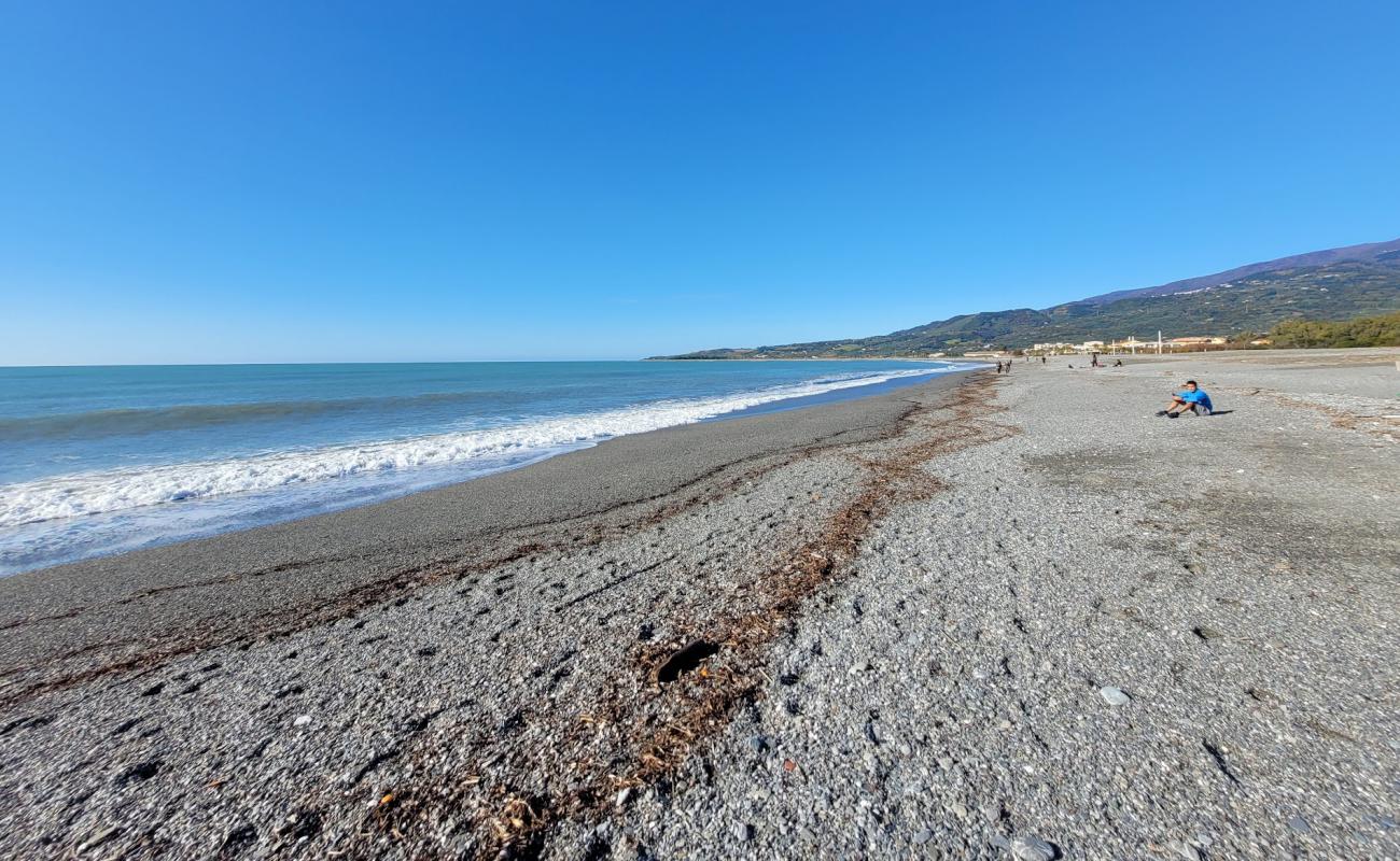 Фото Spiaggia Cafarone с серая чистая галька поверхностью