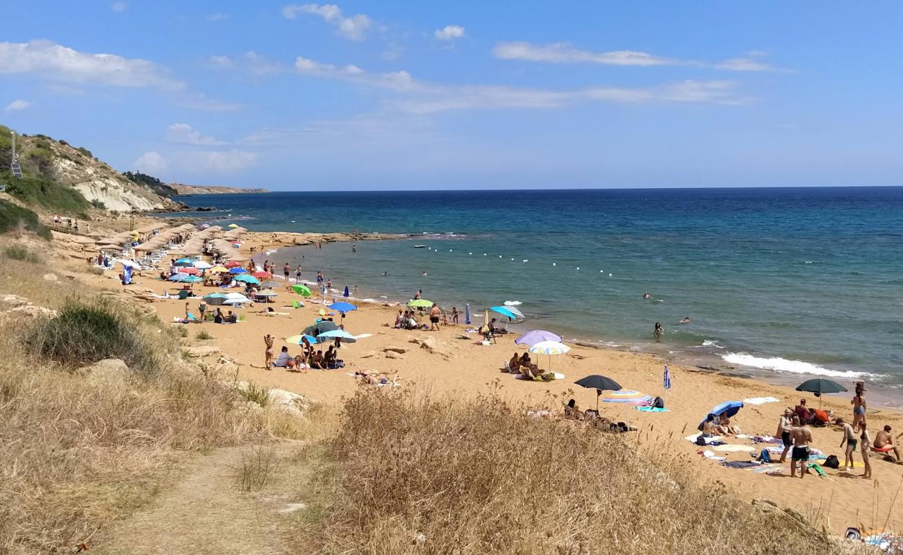 Фото Spiagge Rosse с темный чистый песок поверхностью