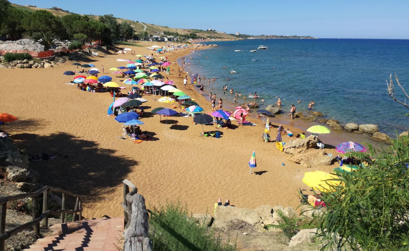 Фото Spiaggia di Marinella с темный чистый песок поверхностью