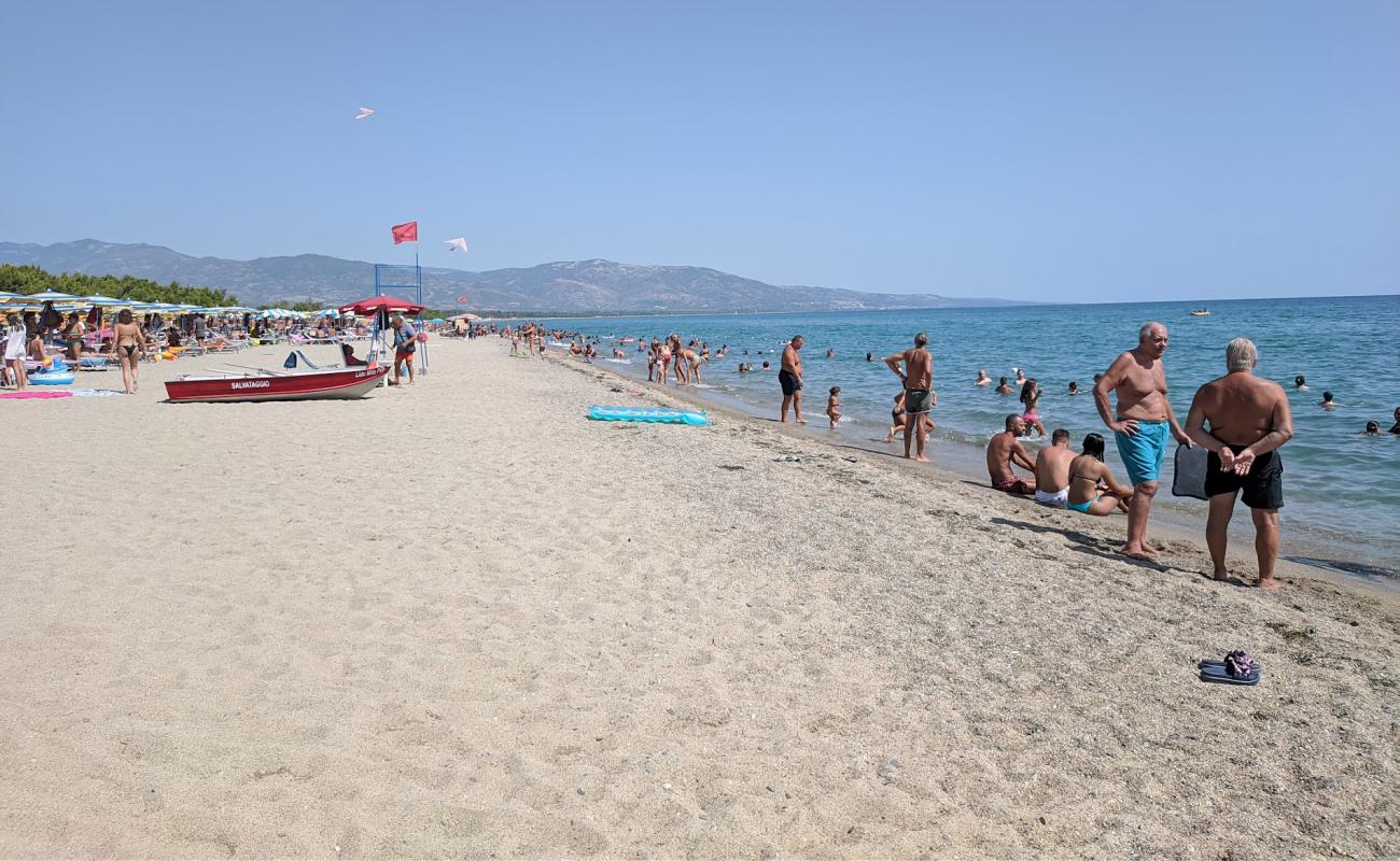 Фото Bruscata Grande beach с светлый песок поверхностью