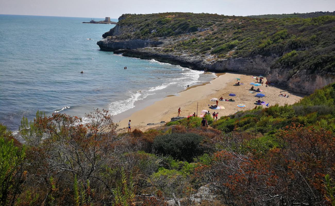 Фото Cala dei Turchi с темный чистый песок поверхностью