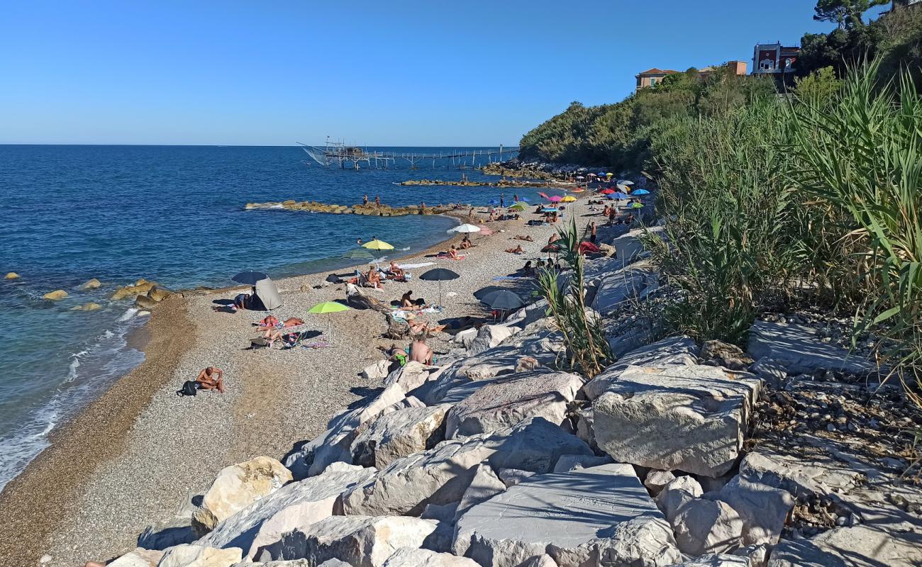 Фото Spiaggia di Calata Turchino с светлая галька поверхностью