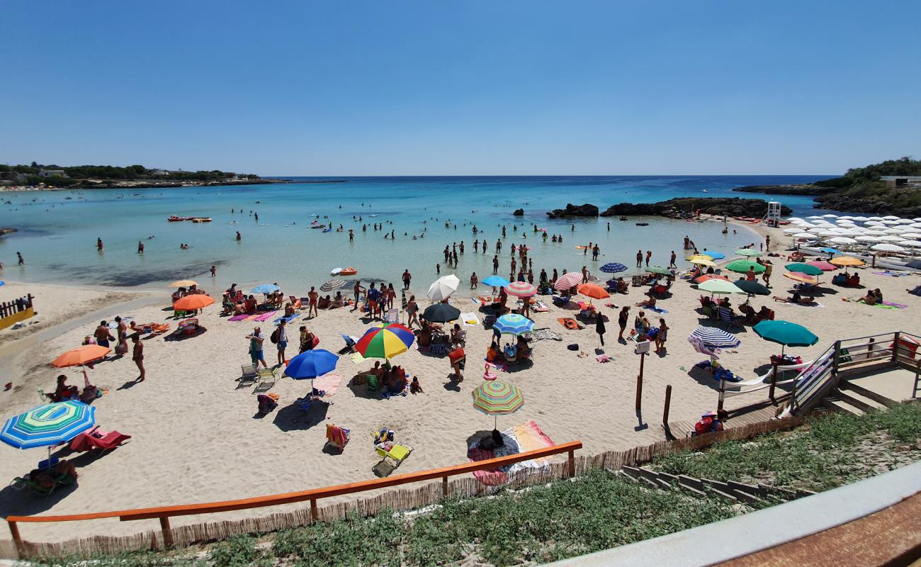 Фото Baia delle Canne с темный песок поверхностью