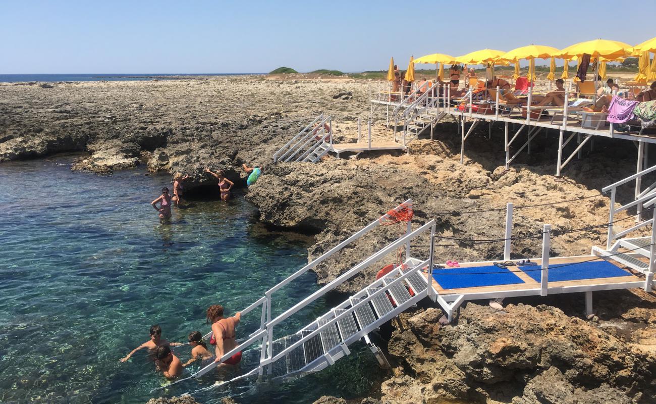 Фото Spiaggia di Serra Cicora II с бетон поверхностью