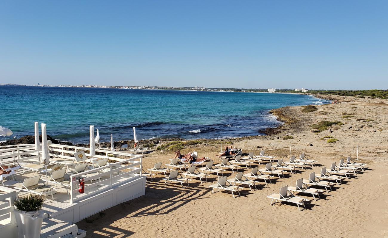 Фото Spiaggia di Punta della Suina с бетон поверхностью