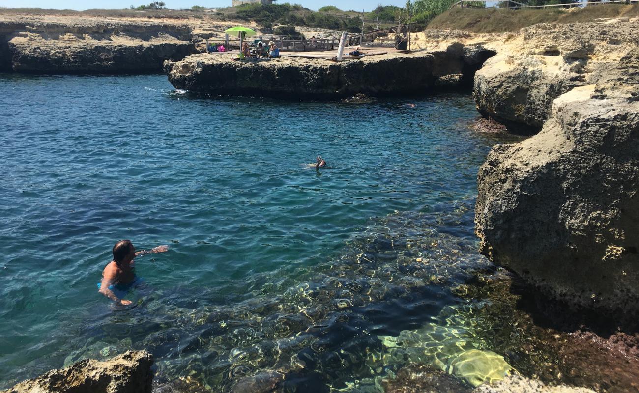 Фото Cala di San Pietro с камни поверхностью