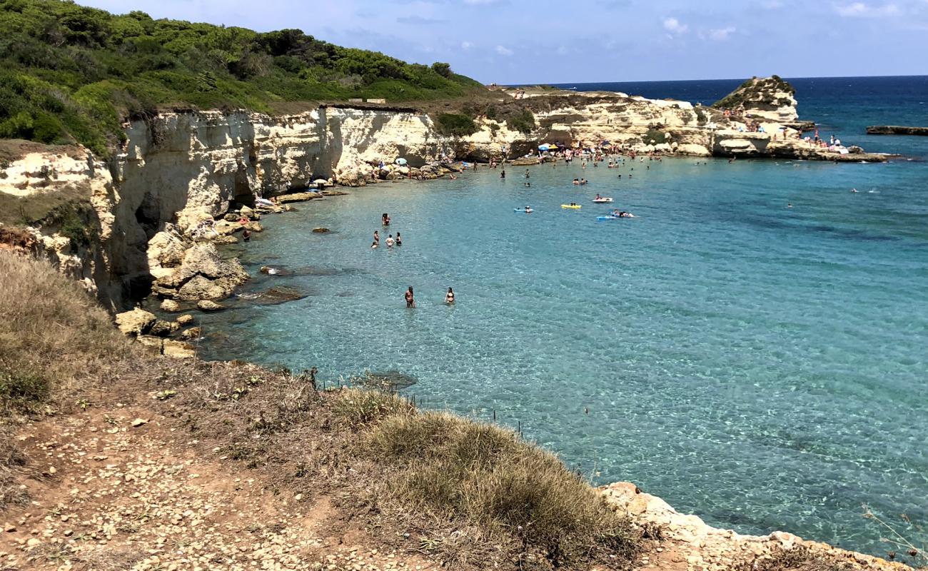 Фото Spiaggia della Punticeddha с светлый песок поверхностью