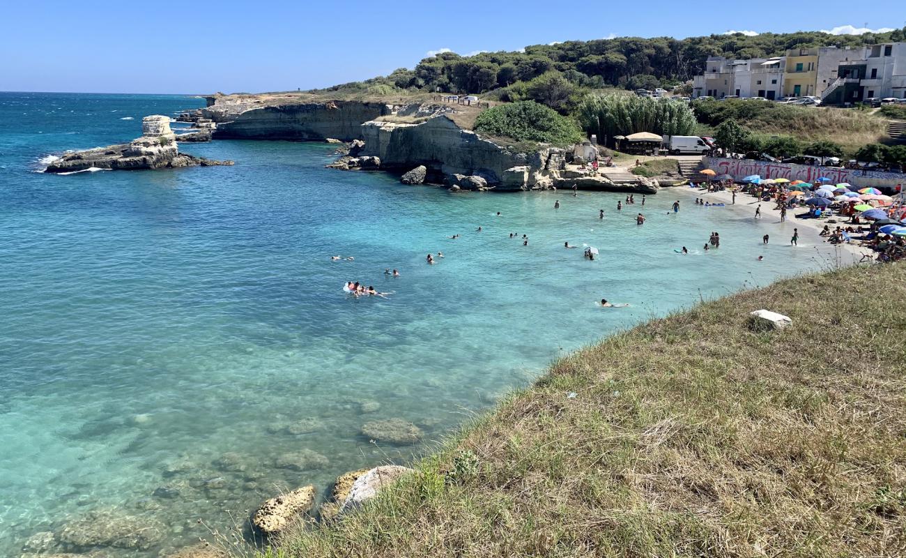 Фото Torre Sant'Andrea с светлый песок поверхностью