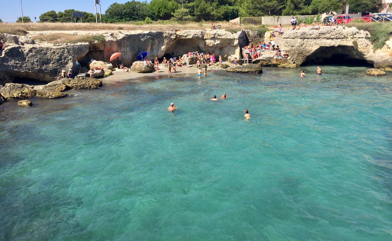 Фото Nfucaciucci beach с камни поверхностью