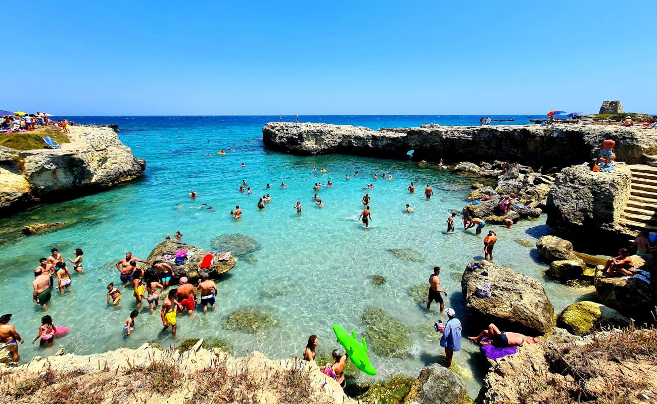 Фото Spiaggia di Portulignu с камни поверхностью