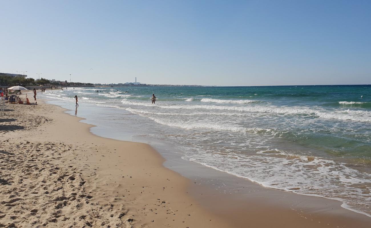 Фото Benny beach с золотистый песок поверхностью