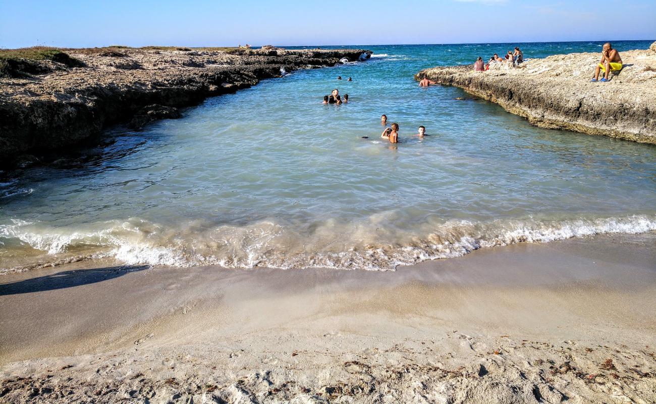 Фото Costa Merlata beach с светлый песок поверхностью