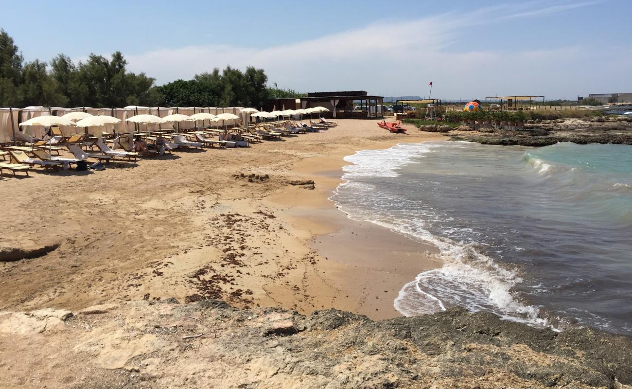 Фото La Fonte beach с светлый песок поверхностью