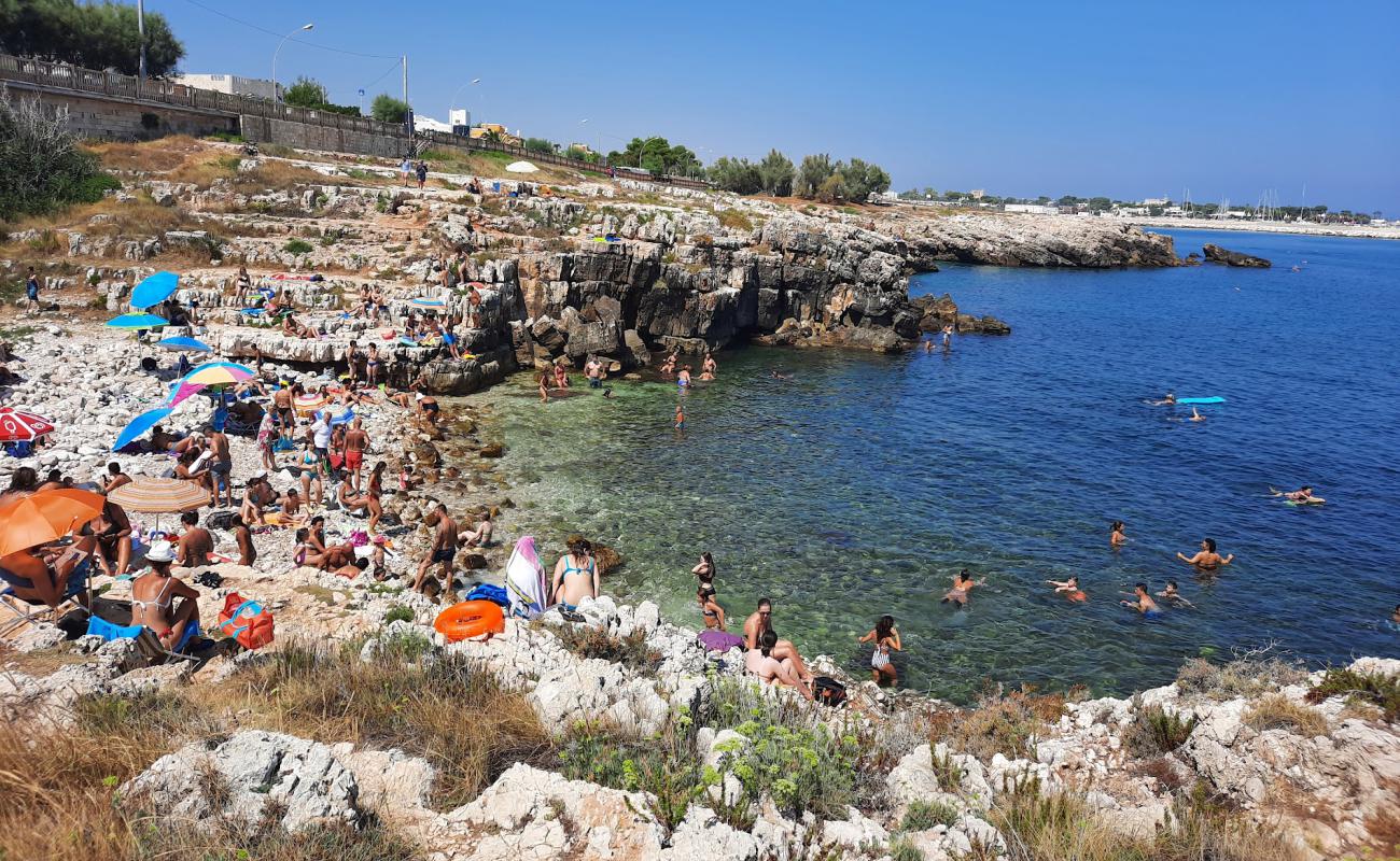 Фото Ponte dei Lapilli beach с камни поверхностью