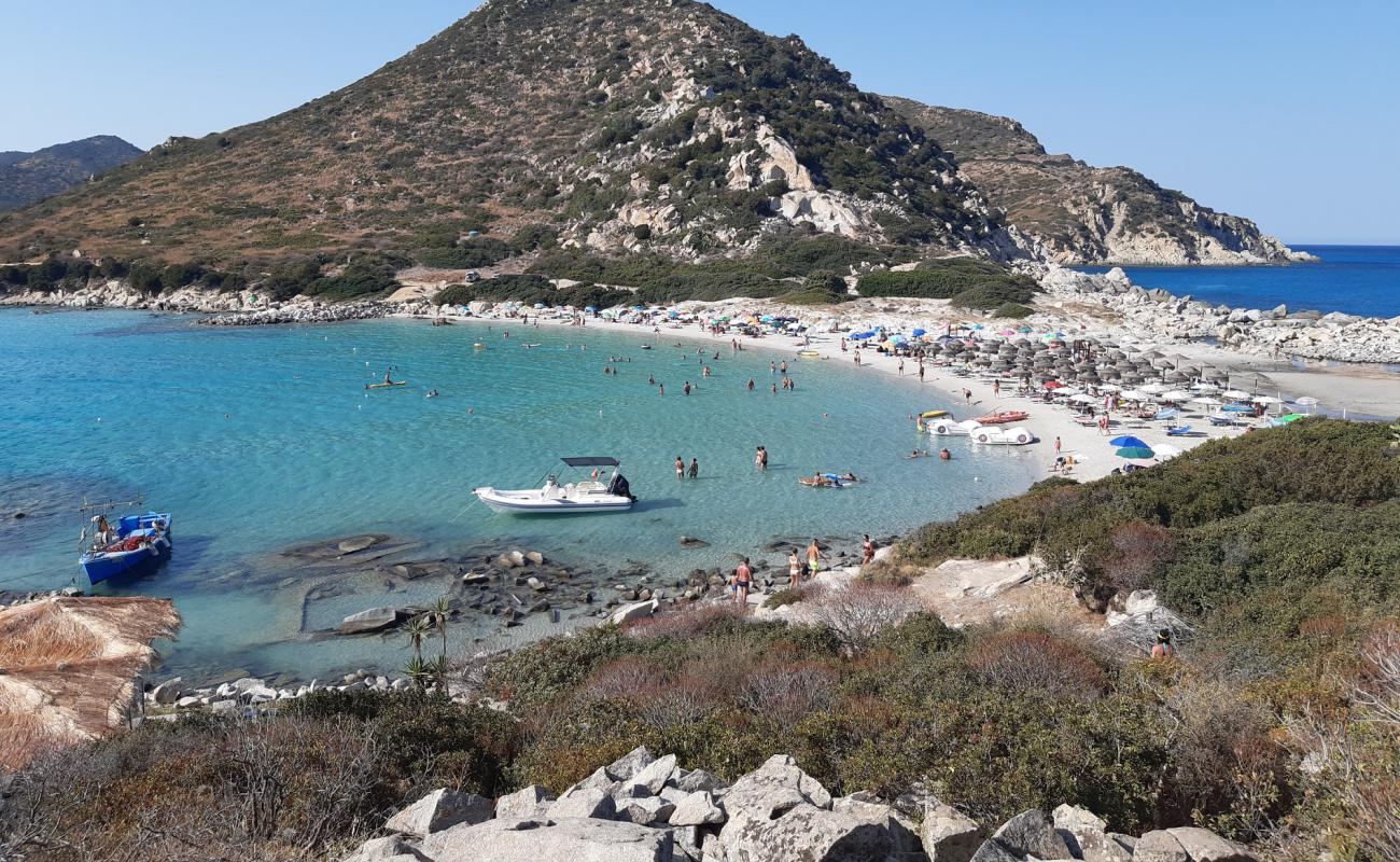 Фото Spiaggia Di Punta Molentis с белый чистый песок поверхностью