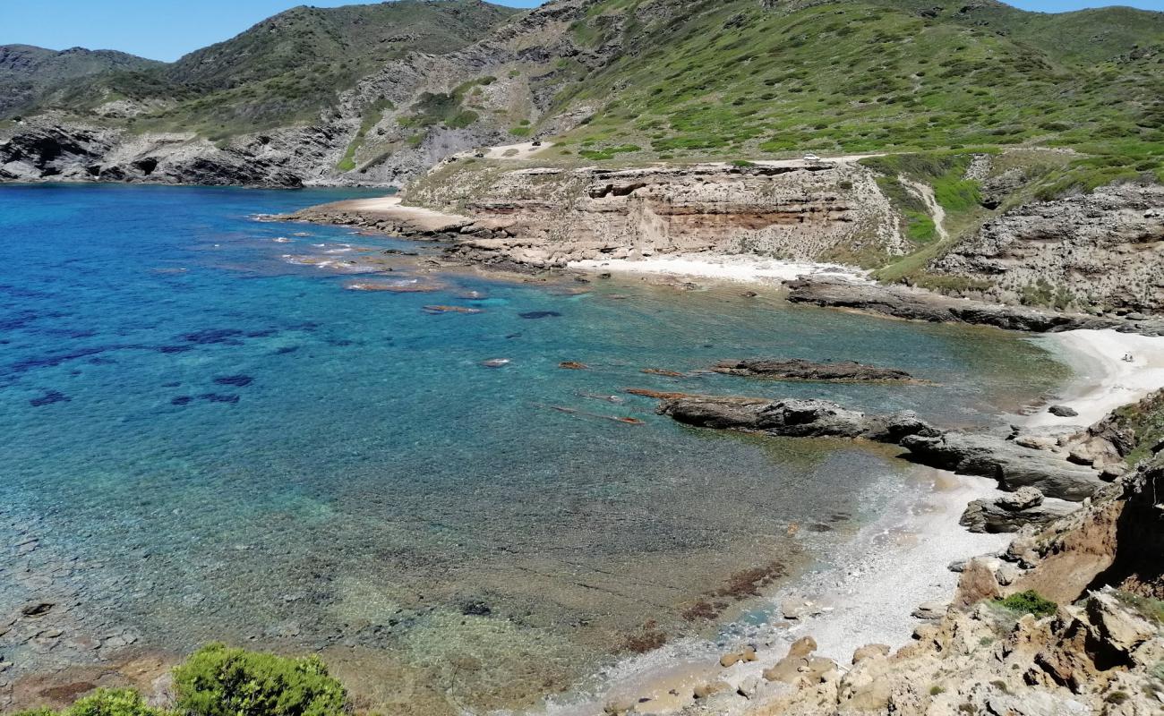 Фото Cala Ebi Dozzi с песок с галькой поверхностью