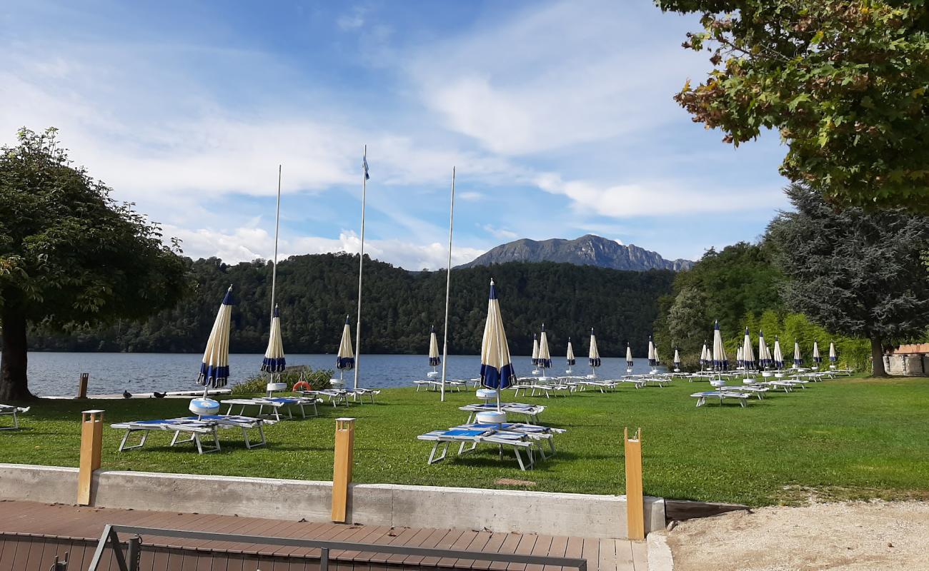 Фото Spiaggia La Taverna с светлая галька поверхностью