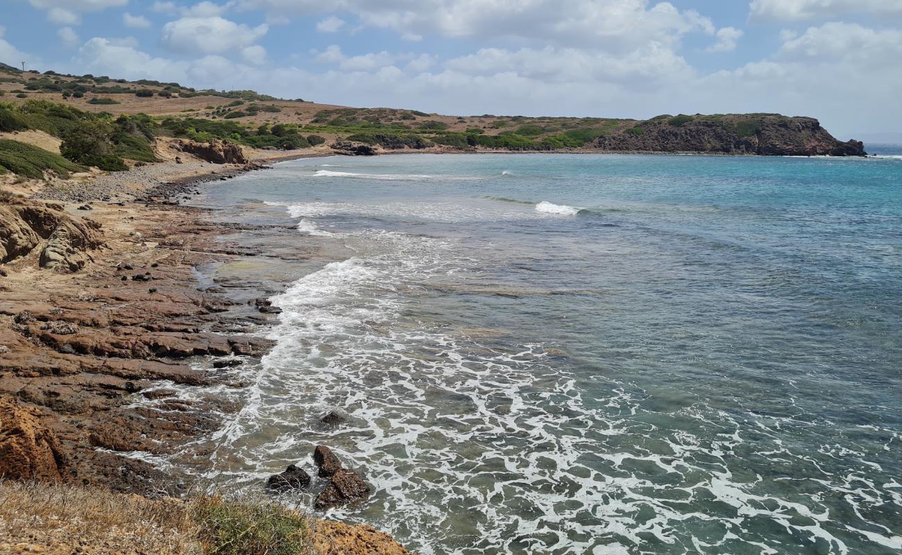 Фото Spiaggia di Capo Sperone с песок с камнями поверхностью