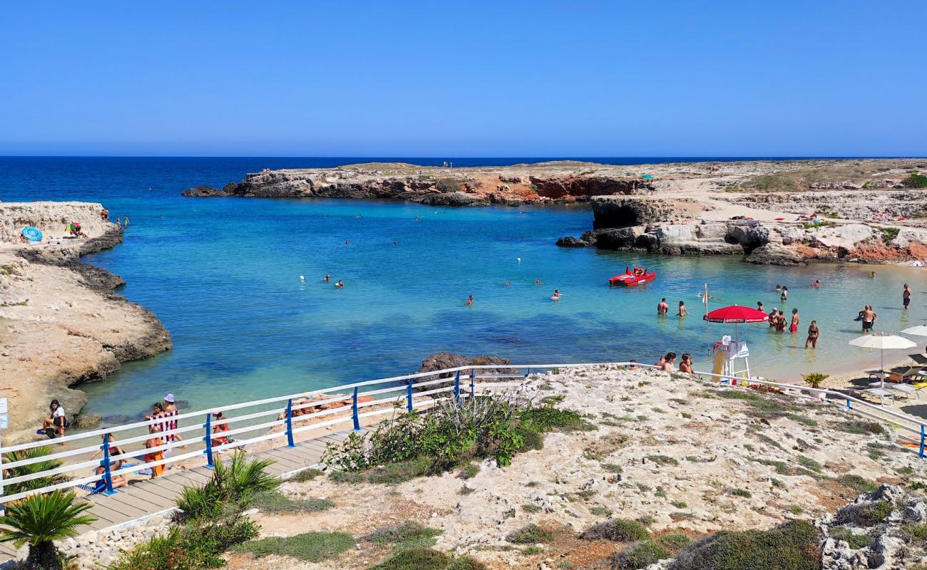 Фото Cala Paradiso с светлый песок поверхностью