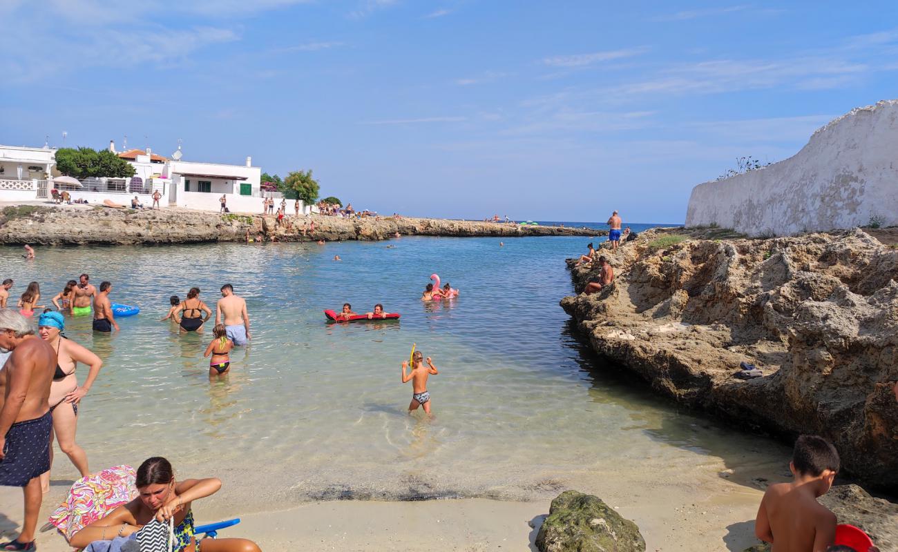 Фото Spiaggia Porto Contessa с светлый песок поверхностью