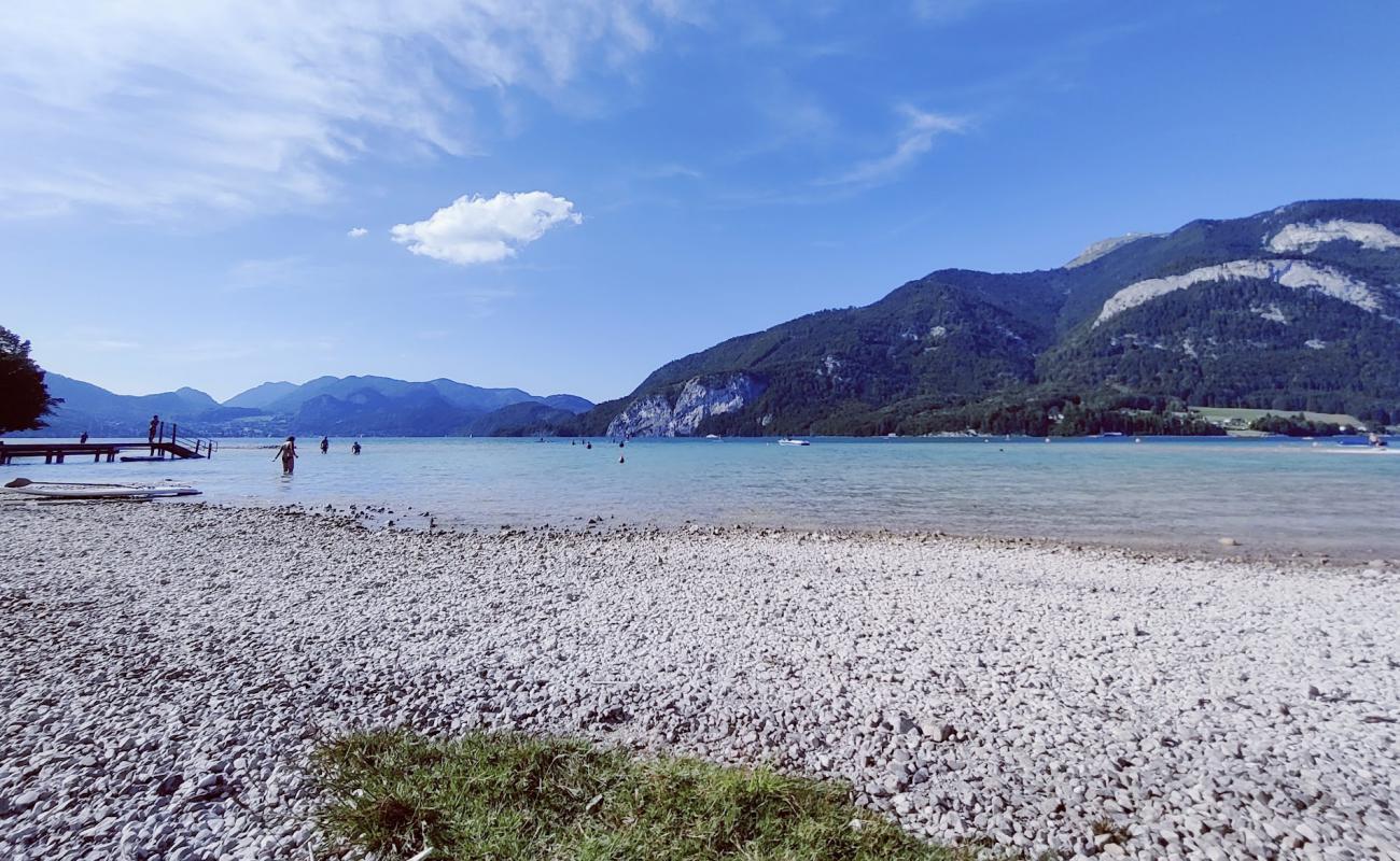 Фото Schwand Strand с белая чистая галька поверхностью