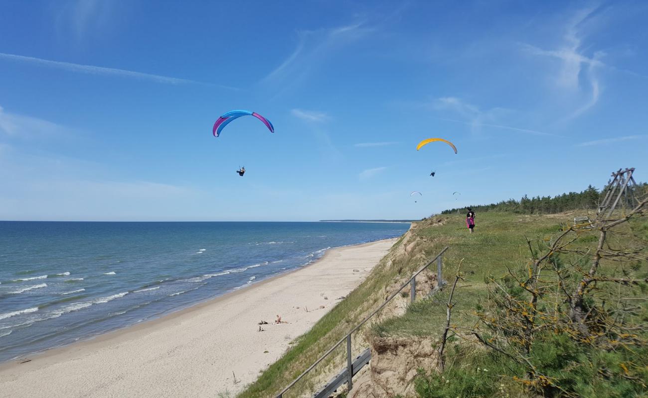 Фото Cerini beach с светлый песок поверхностью