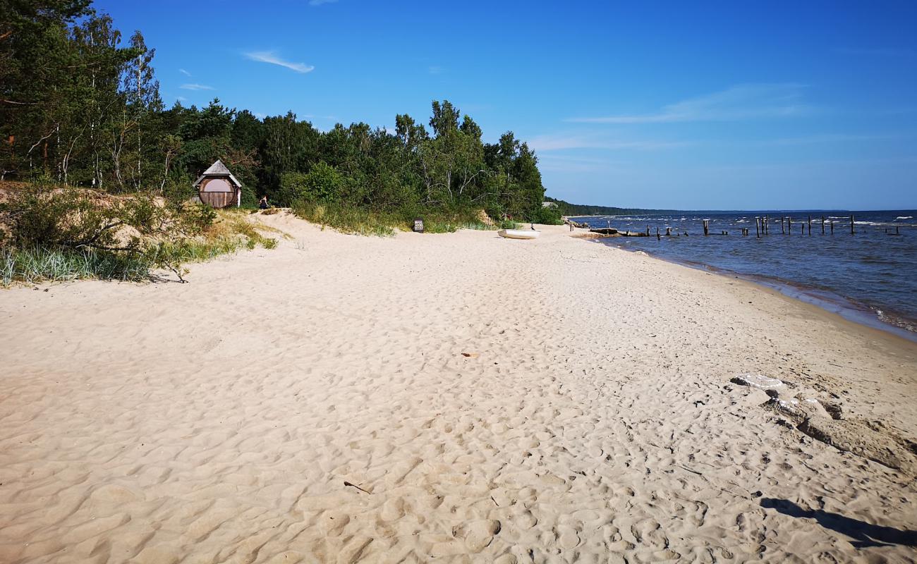 Фото Melnsils beach с светлый песок поверхностью