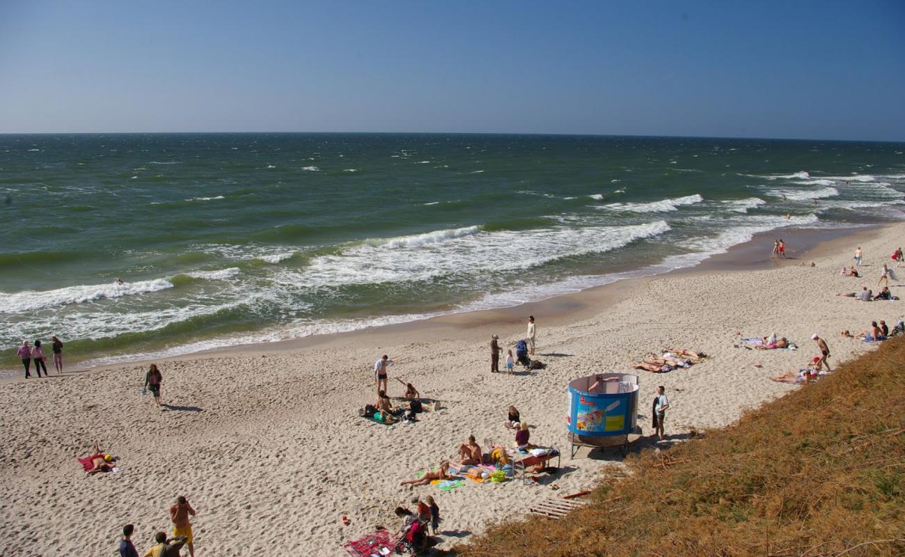 Фото Preilos beach с светлый песок поверхностью