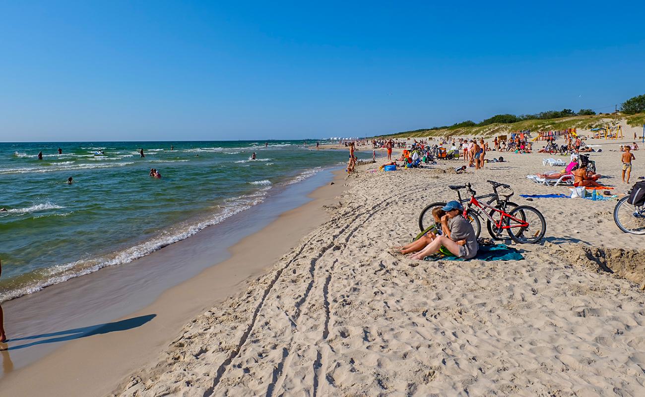 Фото Smiltynes beach с золотистый песок поверхностью