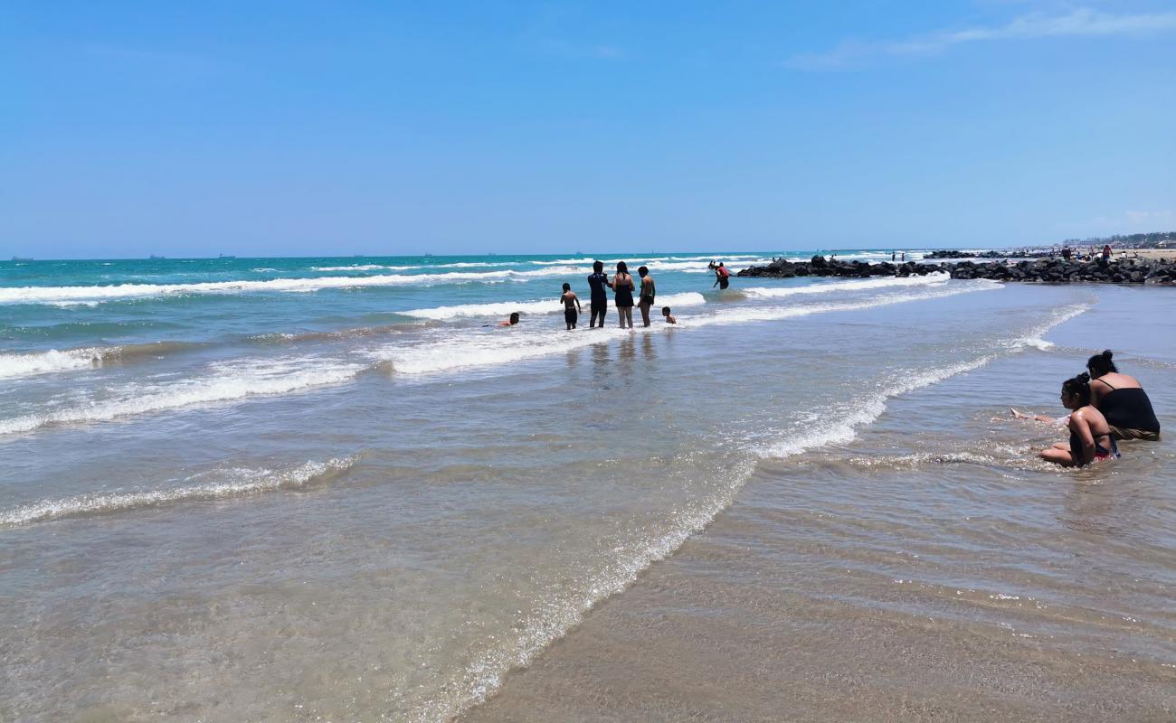 Фото Playa Norte с светлый песок поверхностью