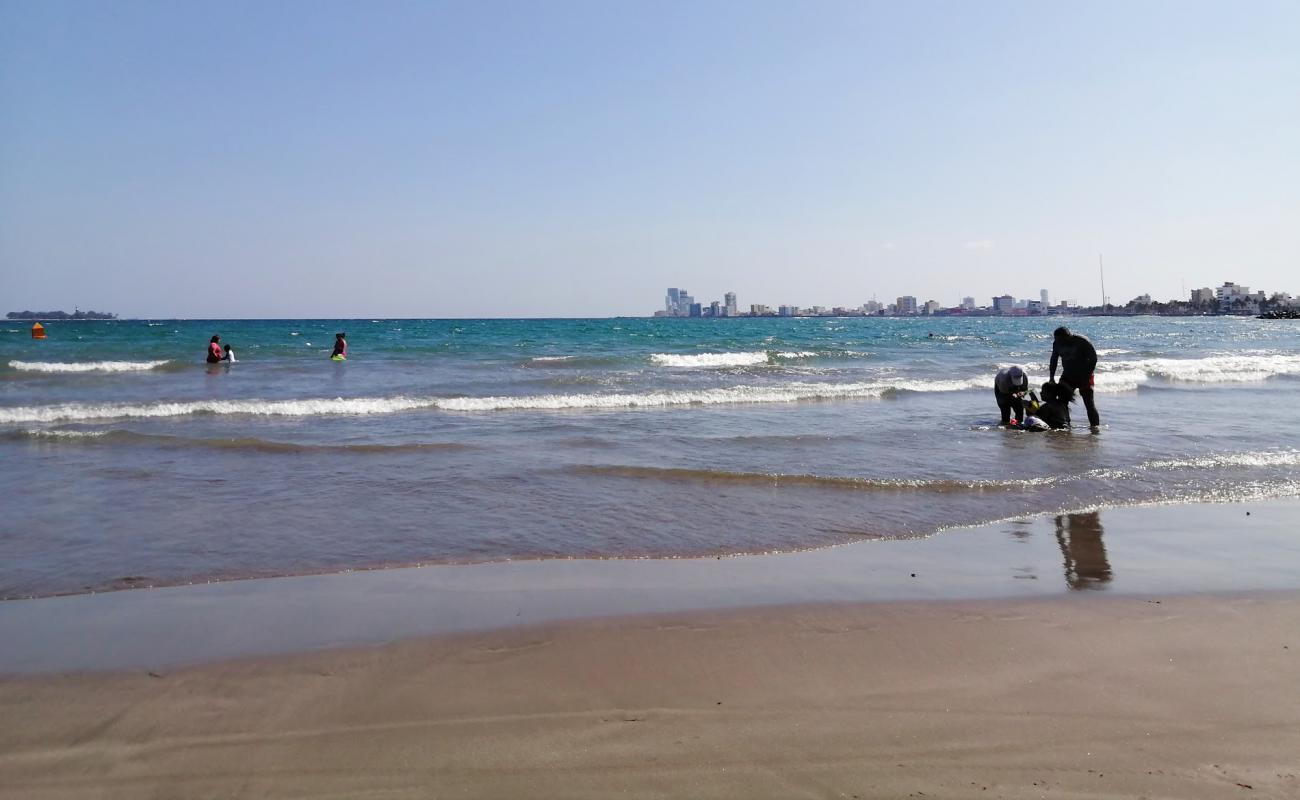 Фото Playa Villa Del Mar с светлый песок поверхностью