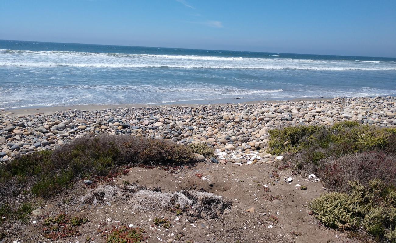 Фото Playa El Socorrito с песок с галькой поверхностью