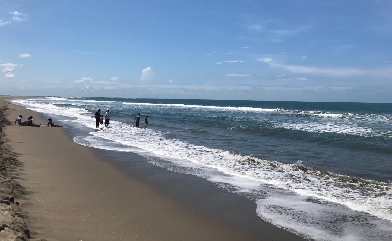 Фото El Tambor beach с светлый песок поверхностью