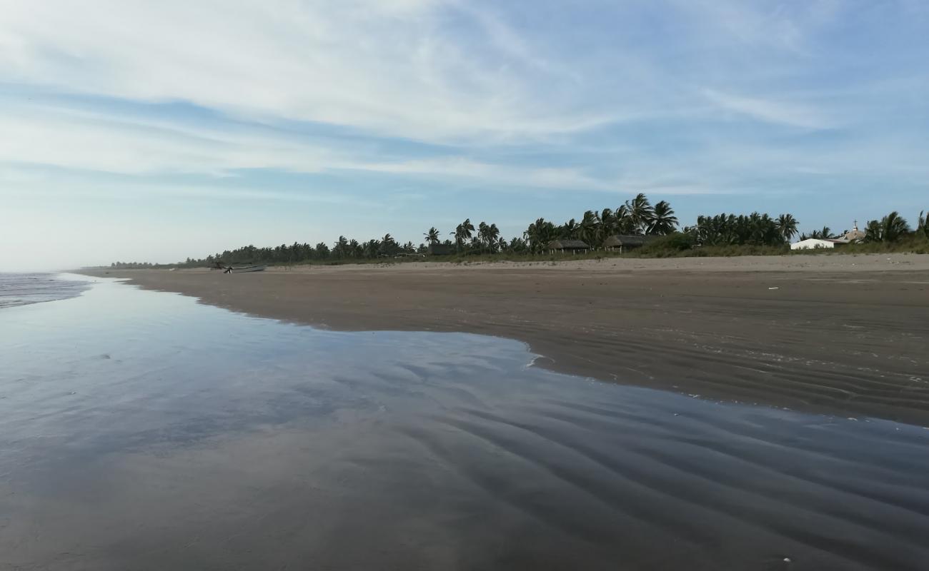 Фото La Puntilla beach с светлый песок поверхностью