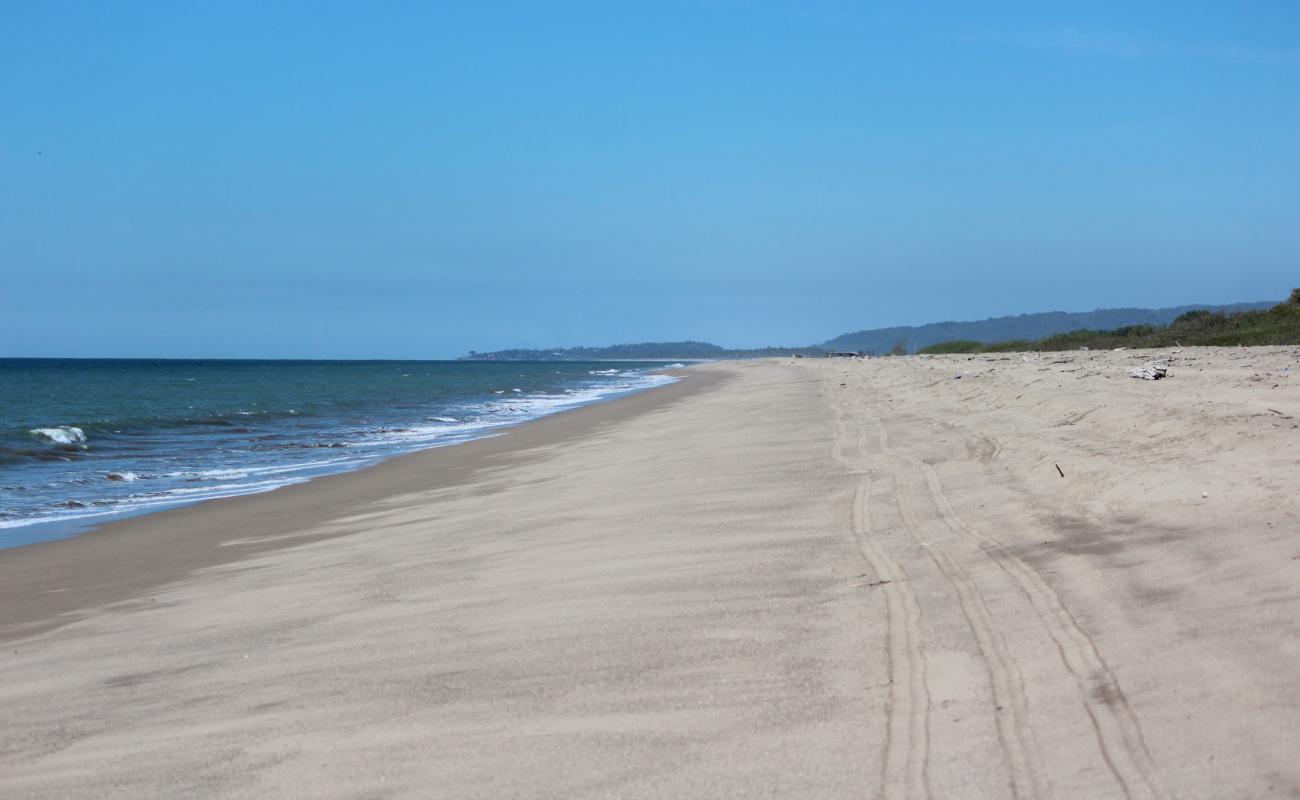 Фото Chila beach II с светлый песок поверхностью