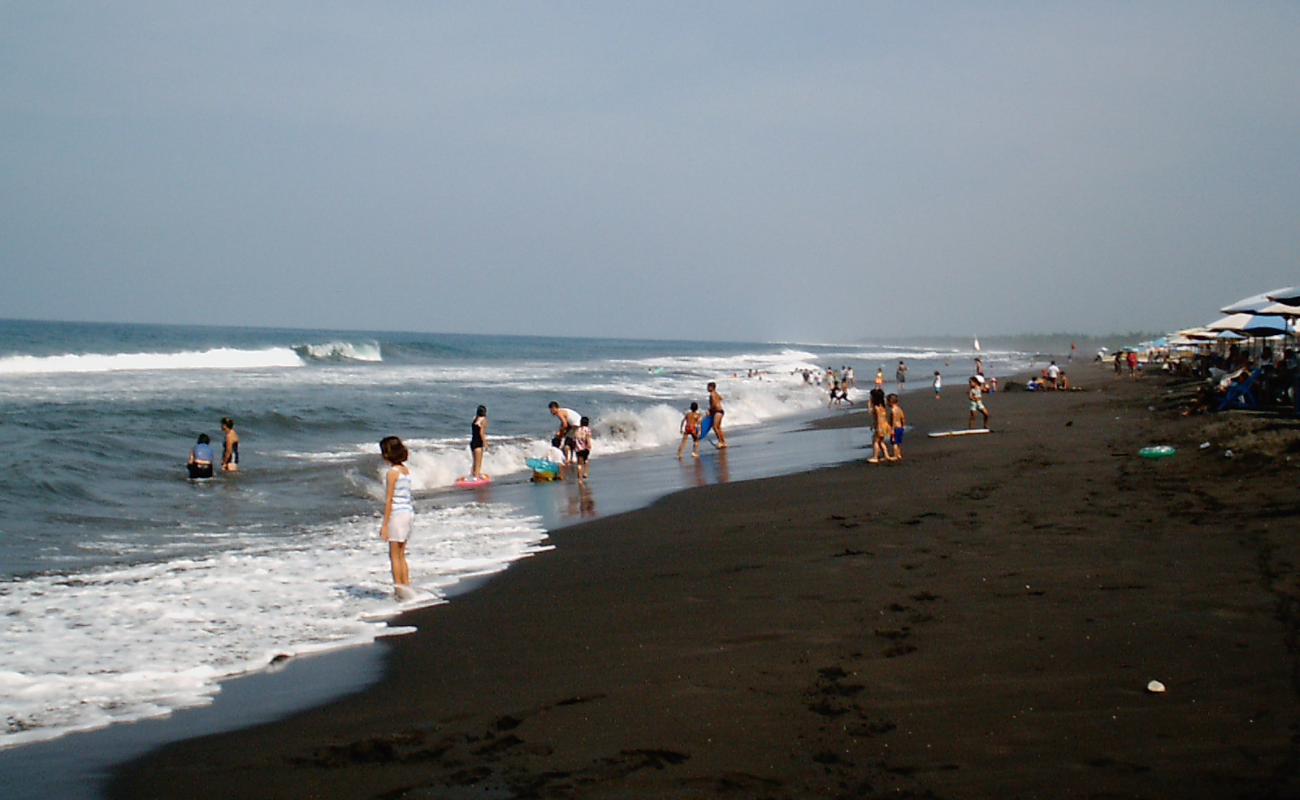 Фото Playa de Cuyutlan с темный песок поверхностью