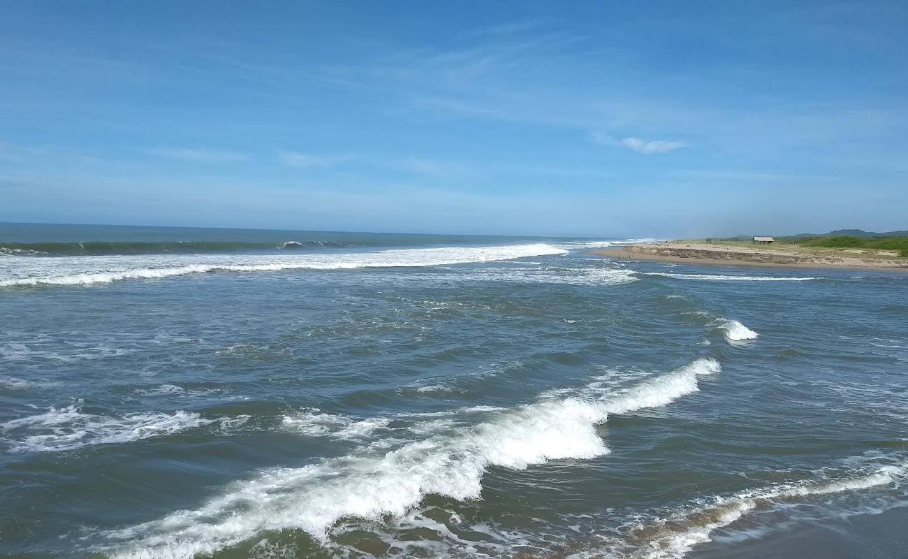 Фото Playa la Tuza de Monroy с светлый песок поверхностью