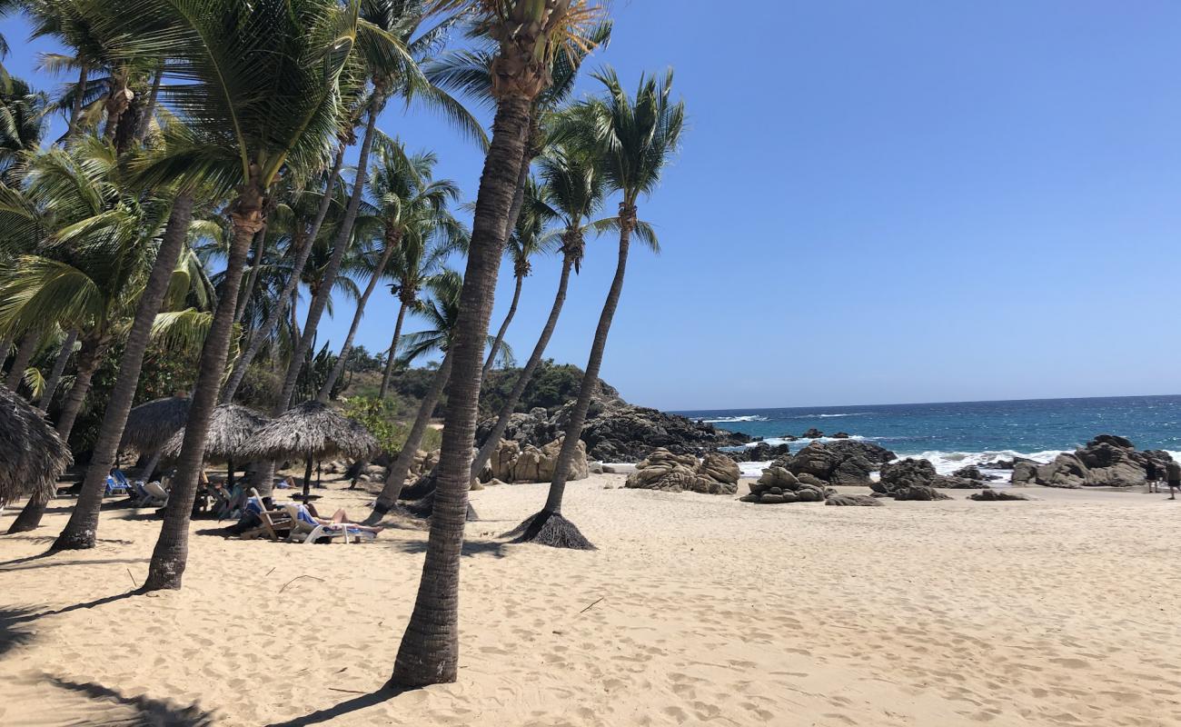 Фото Playa Bacocho с белая чистая галька поверхностью