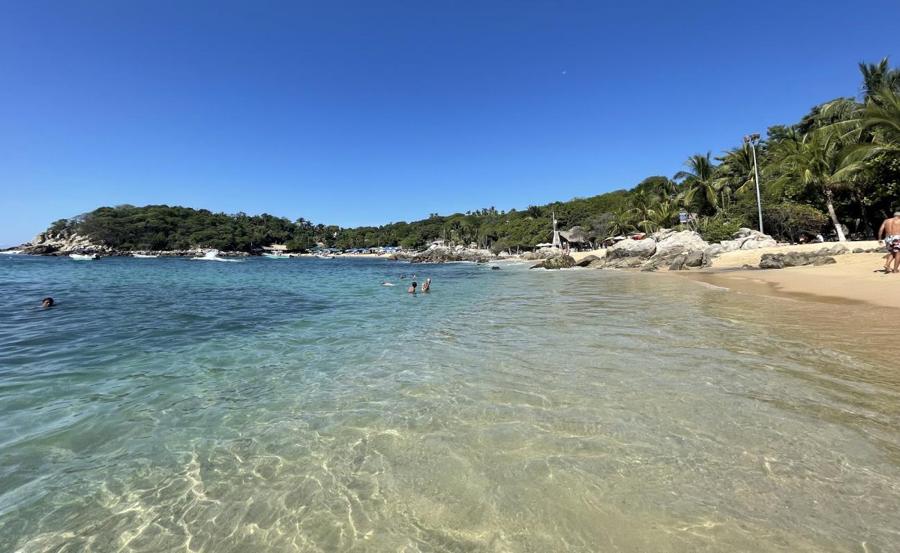 Фото Playa Manzanillo с золотистый песок поверхностью