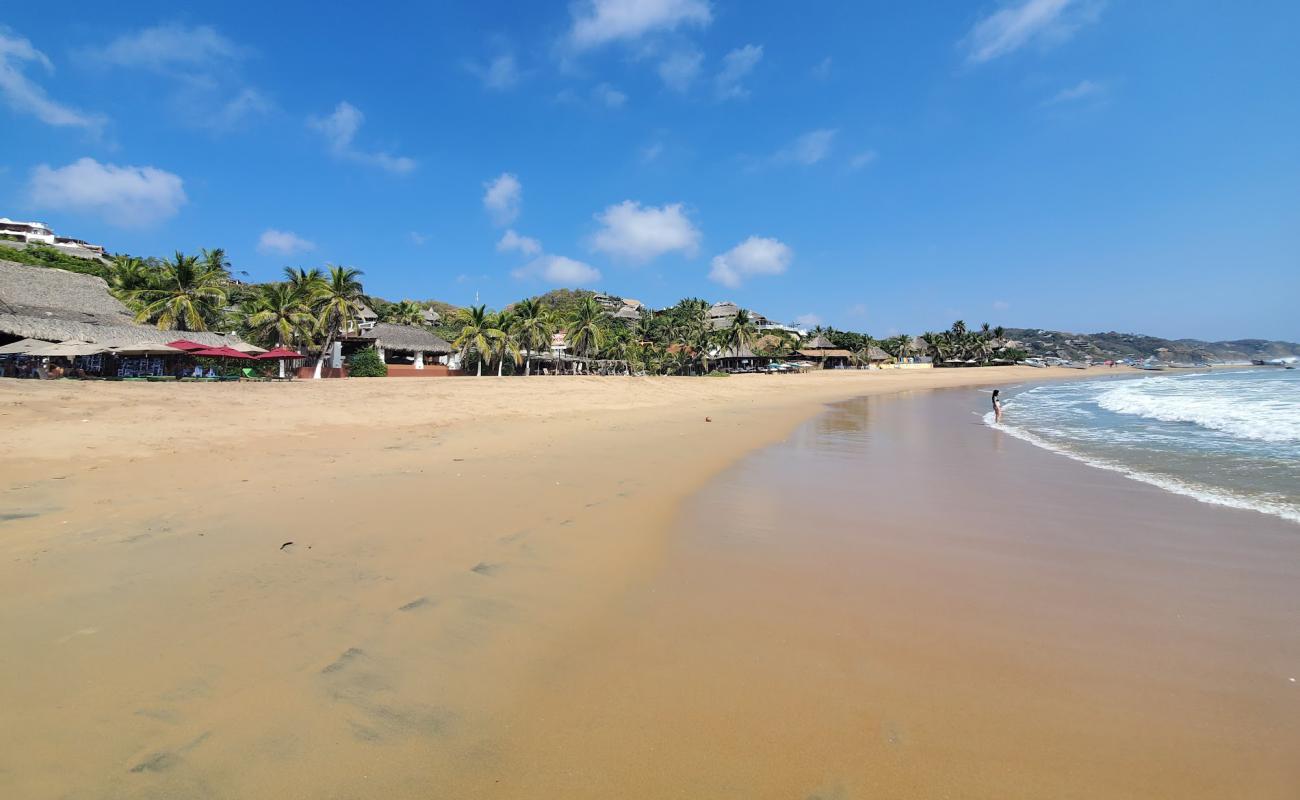 Фото Playa San Agustinillo с золотистый песок поверхностью