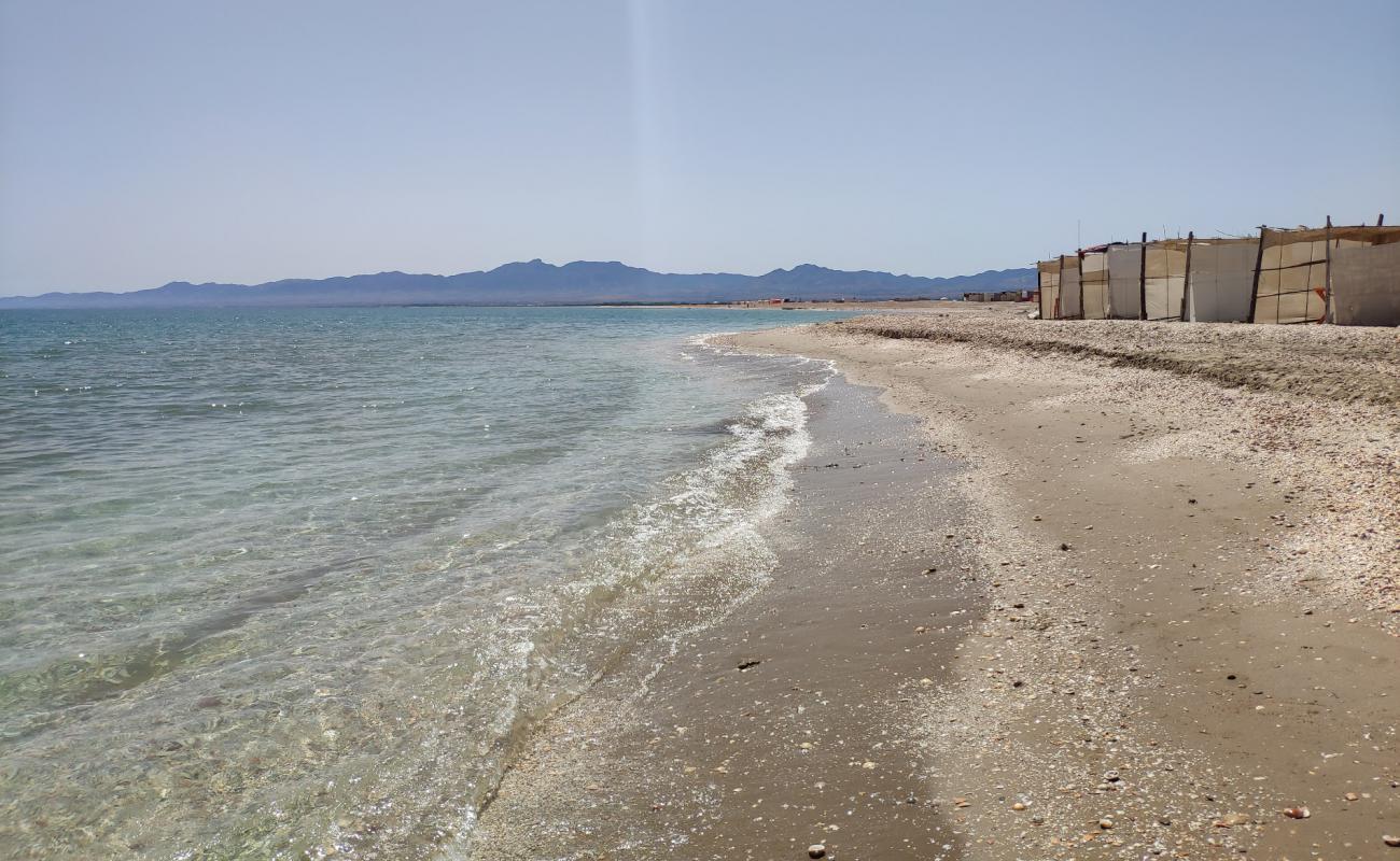 Фото Pores beach с светлый песок поверхностью