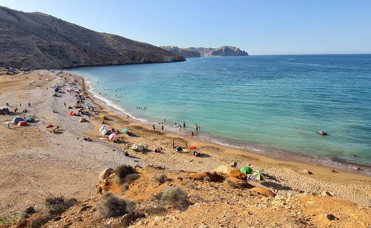 Фото Plage Isri с светлая галька поверхностью