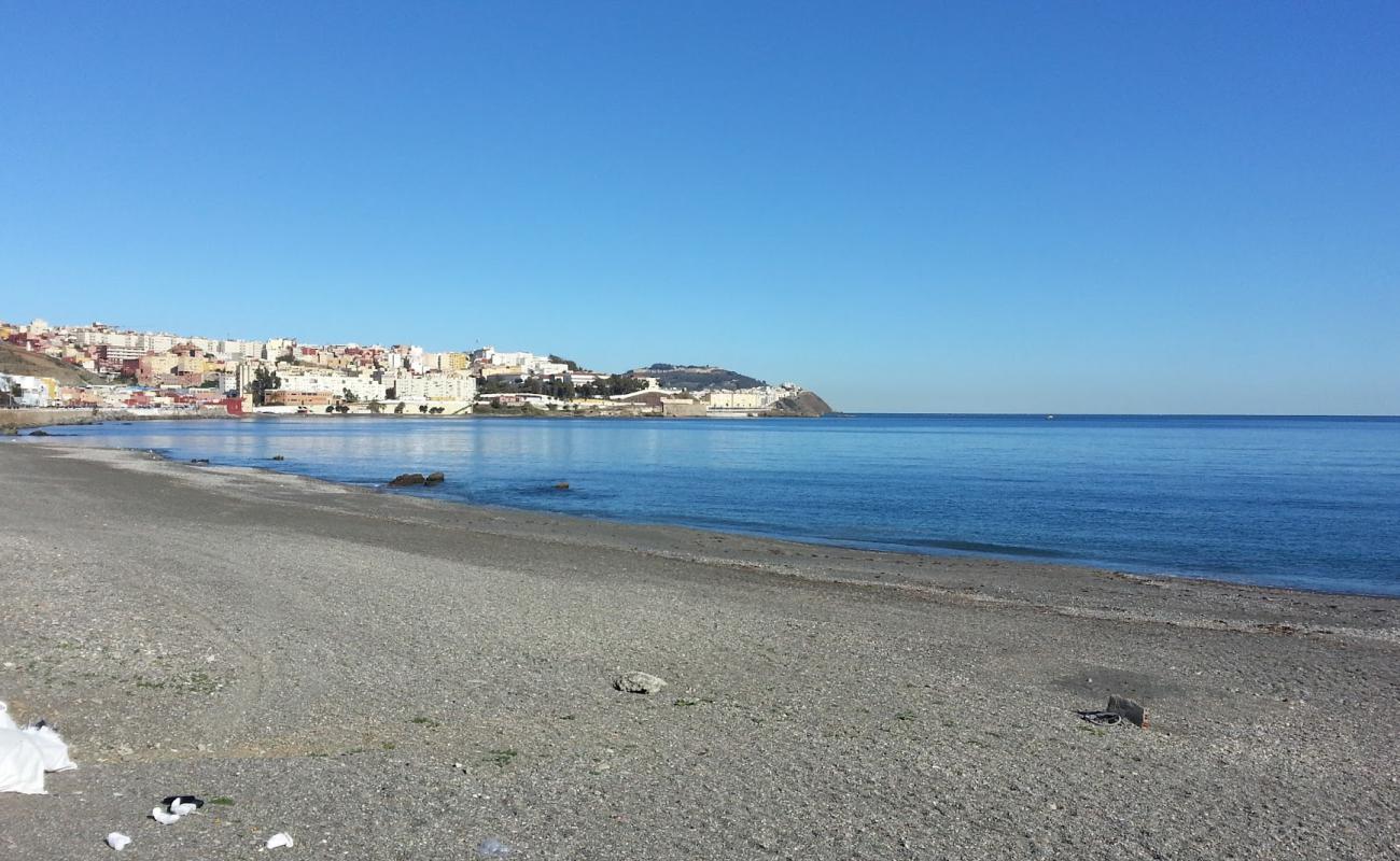 Фото Playa El Tarajal с серая галька поверхностью