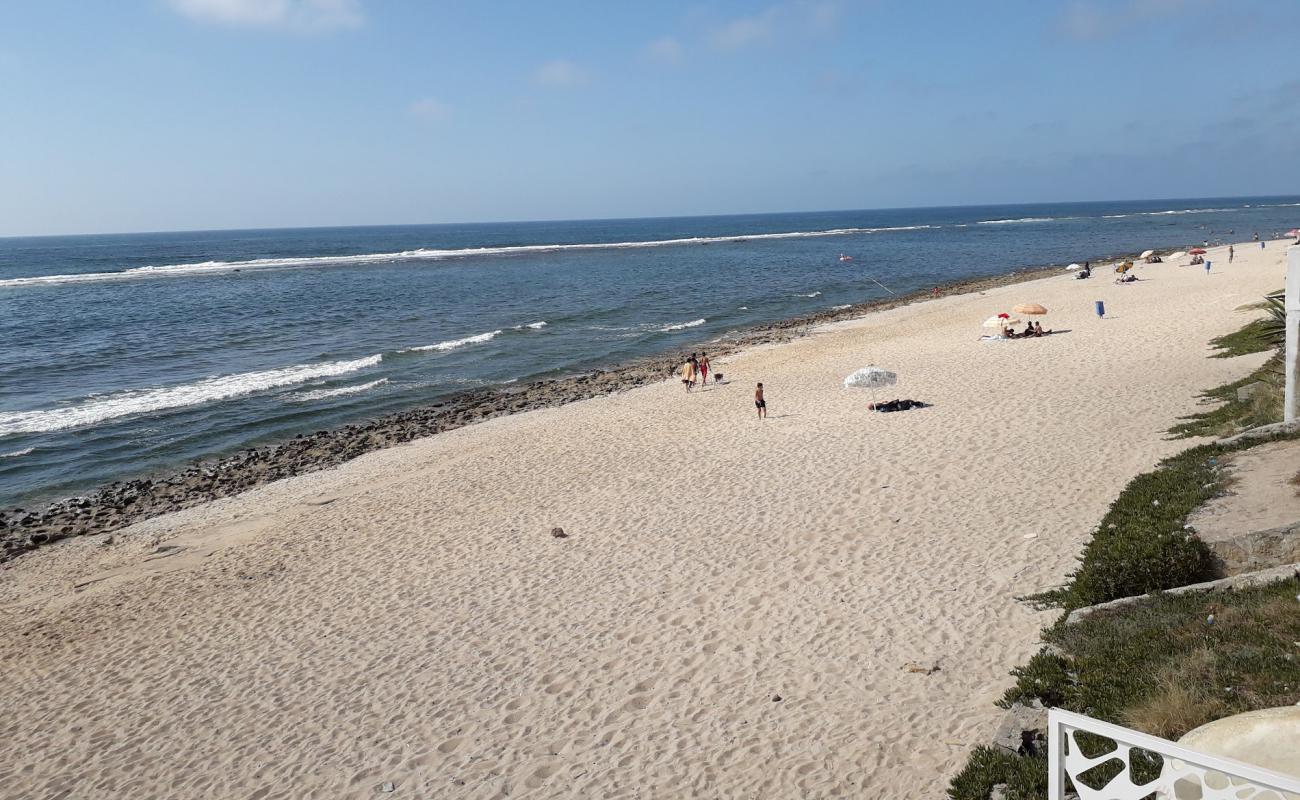 Фото Plage Guy ville с песок с камнями поверхностью