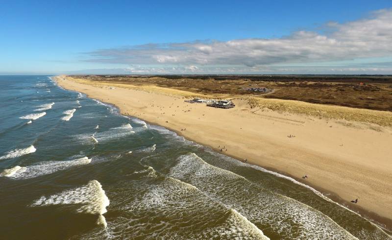 Фото Ecomare beach с светлый песок поверхностью