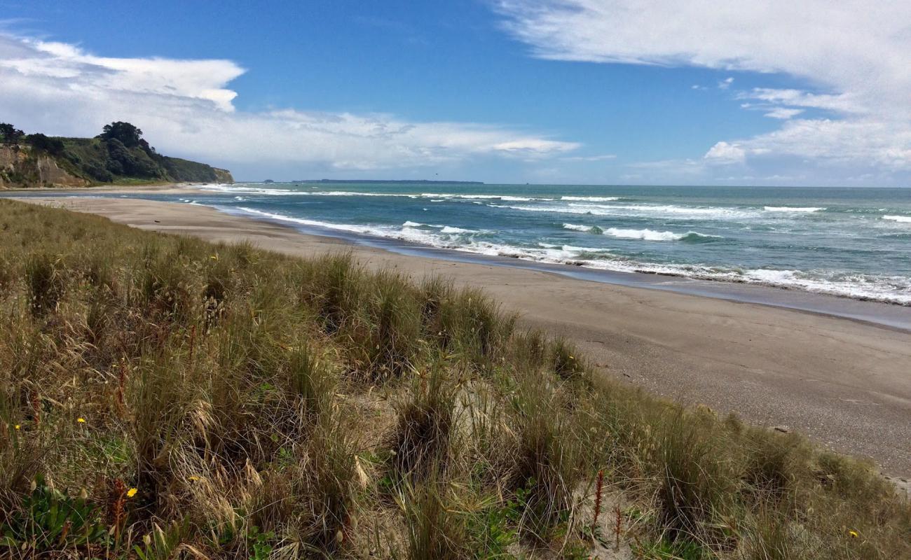 Фото Pukehina Beach с светлый песок поверхностью