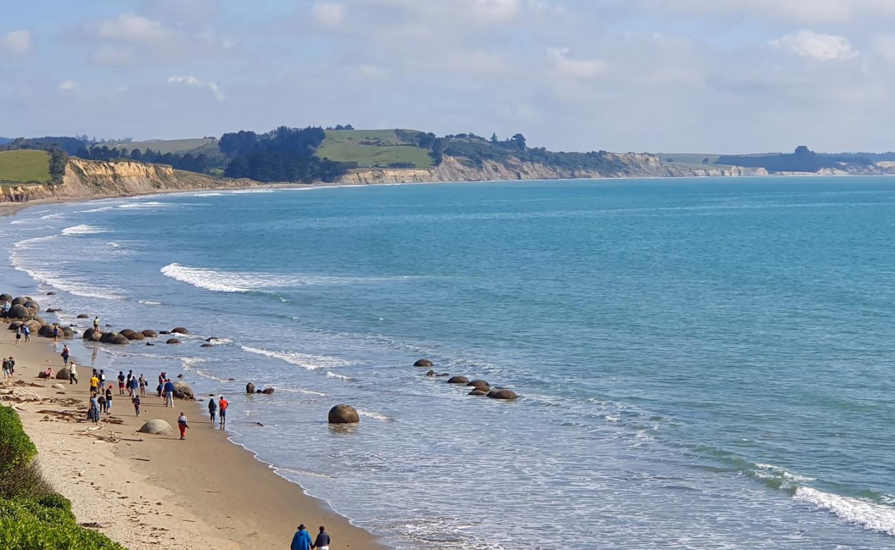 Фото Moeraki Boulders Beach с светлый песок поверхностью