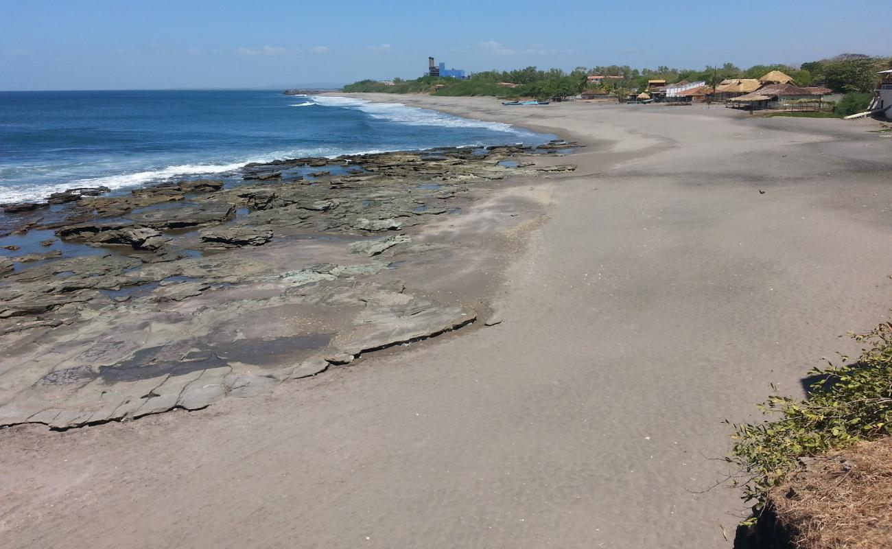 Фото Miramar beach с песок с камнями поверхностью