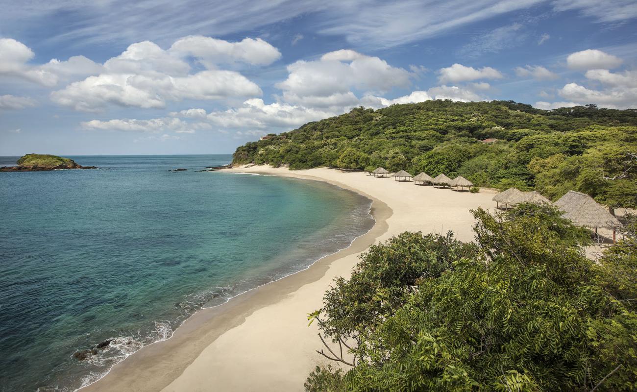 Фото Playa Manzanillo с светлый песок поверхностью